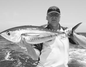 Peter Sharland with a tagged yellowfin about to be released during the Huskisson White Sands Tournament.